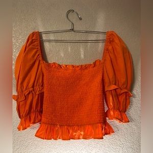 Orange ruffle crop top